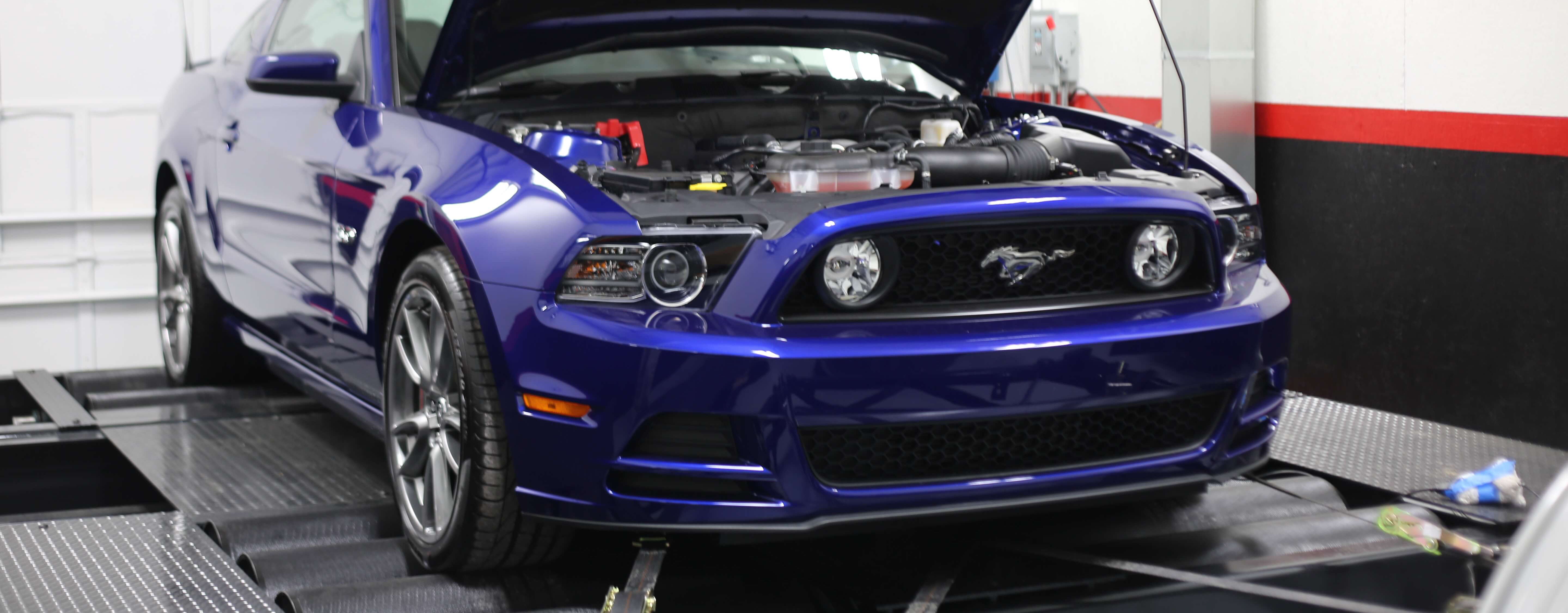 Source capture exhaust removal system installed in enclosed dynamometer room at Franjo Speed performance shop.