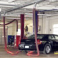 Fume-A-Vent overhead vehicle exhaust removal system installed to capture harmful gas emissions in a repair or maintenance facility.